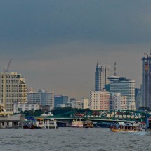 Skyline of Bangkok seen from the public boat on Chao Pram River